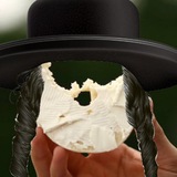a half eaten brooklyn bagel